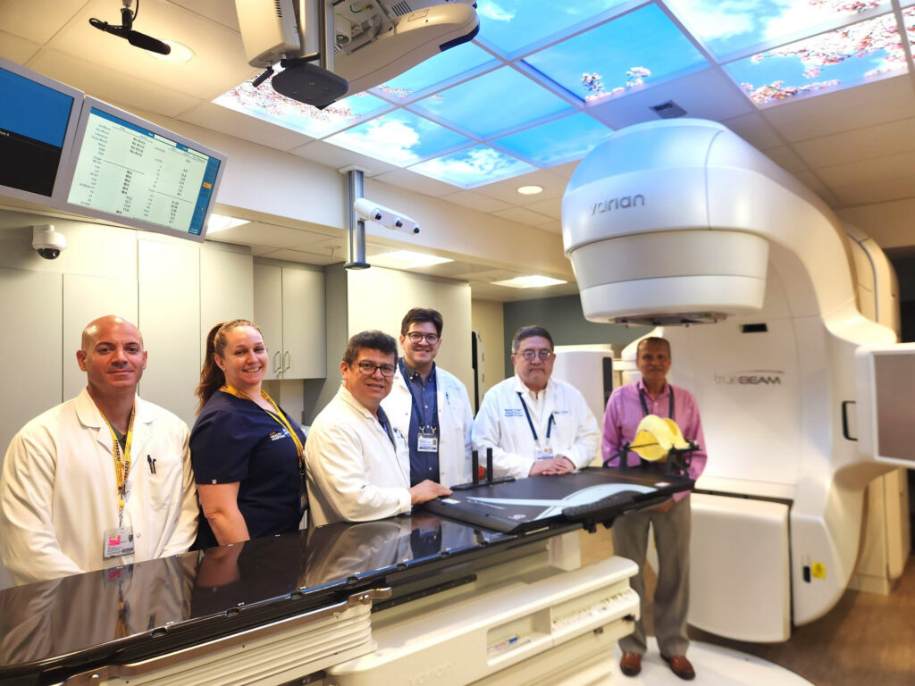 doctors and medical staff stand with new hospital equipment